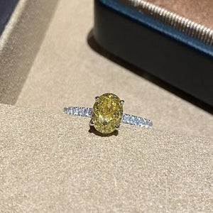 ring in yellow featuring oval cut zircon and straight fit