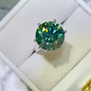 Emerald cut green moissanite solitaire ring in 925 sterling silver.