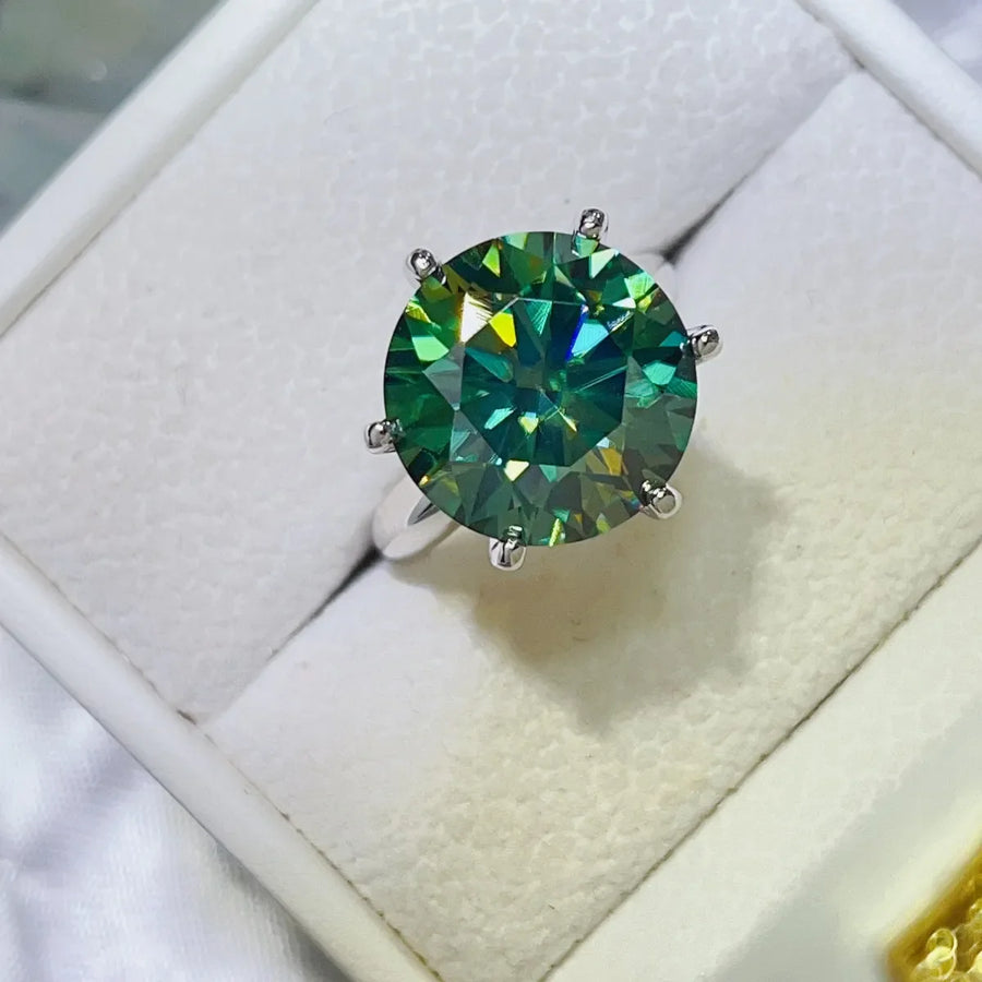 Emerald cut green moissanite solitaire ring in 925 sterling silver.