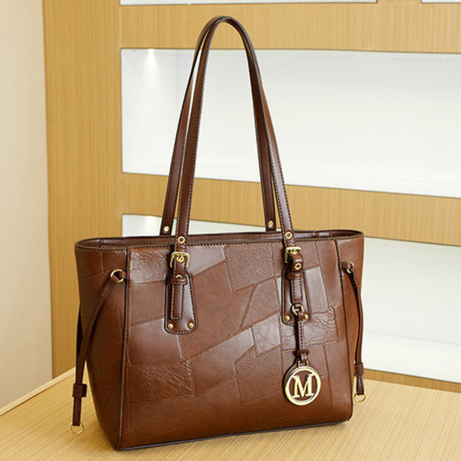 Patchwork Leather Tote Bag With Gold Charm in Brown with gold logo charm