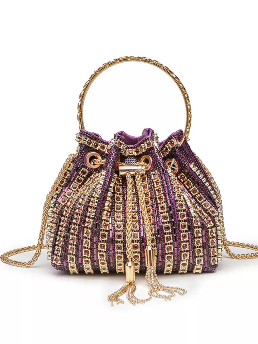 Purple rhinestone embellished mini crossbody bucket bag with gold chain strap and tassels.