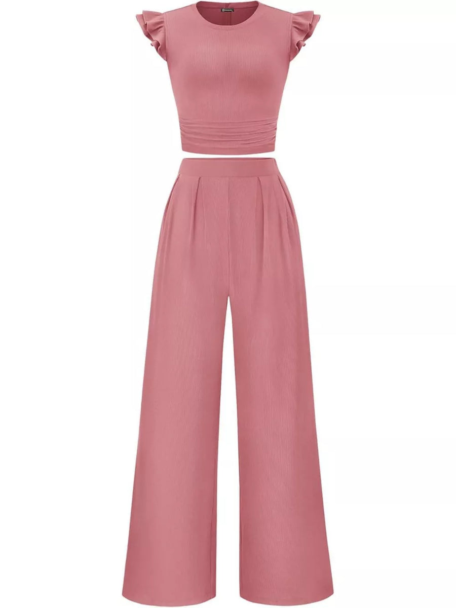Pink ruffled cap sleeve maternity two-piece set with ruched waist top and wide-leg pants.