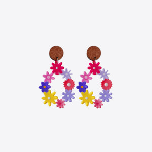 Floral wreath dangle earrings with colorful flowers and wooden tops.