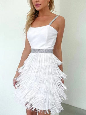 White cami mini dress with fringe trim and sequin belt