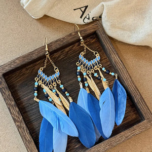 Blue feathered cascade & enamel drop earrings with gold accents and beads.