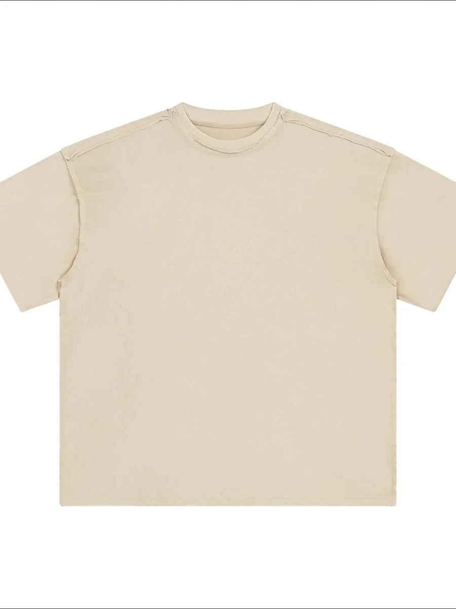 Beige washed cotton t-shirt with raw seams and crew neck.