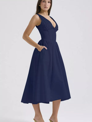 Navy V-neck midi dress with a-line skirt and pockets.