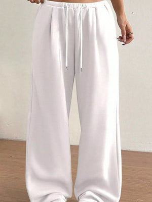 White wide-leg maternity joggers with drawstring waist and relaxed fit.
