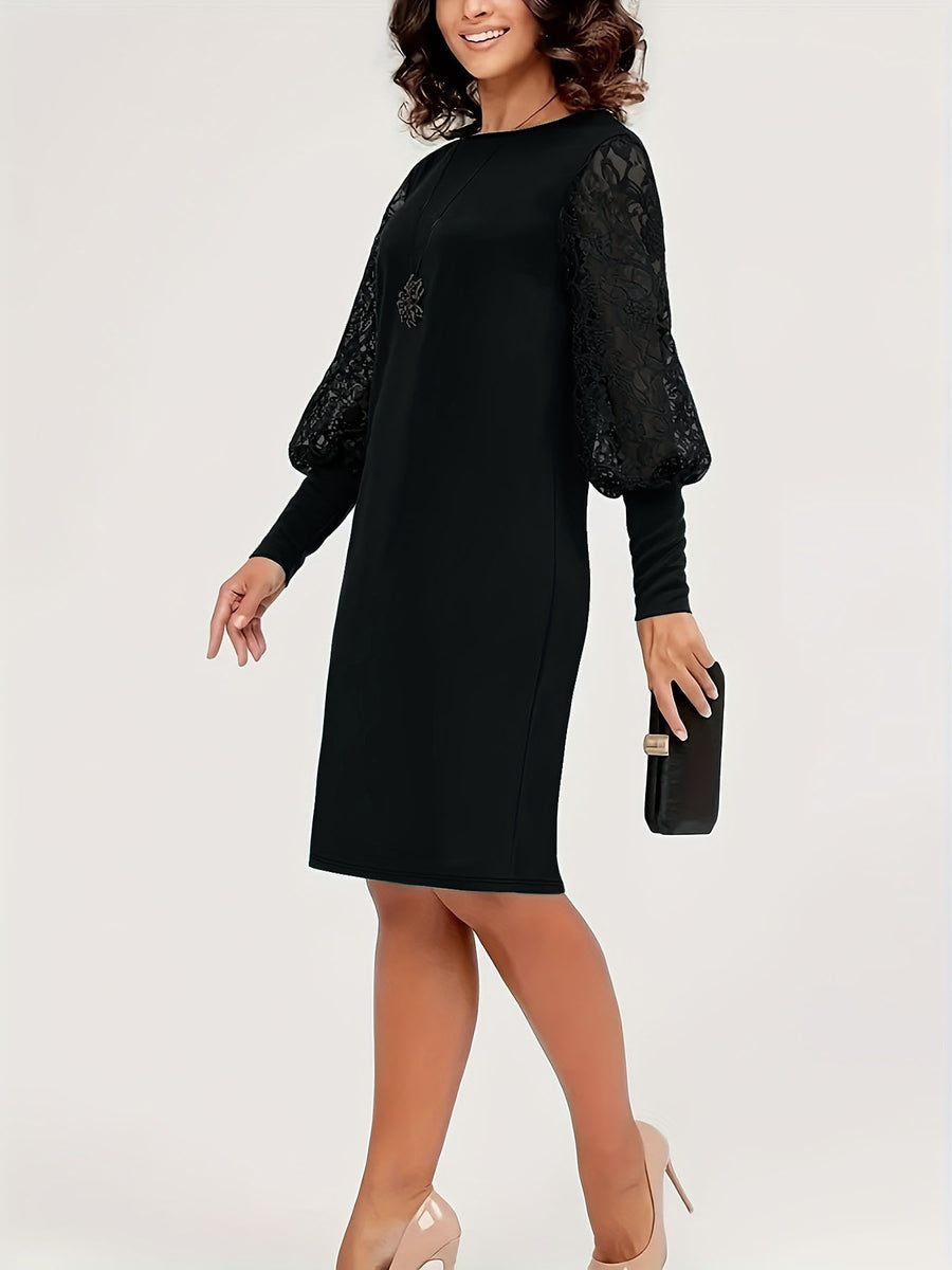 Black mini dress featuring lace sleeves and lace