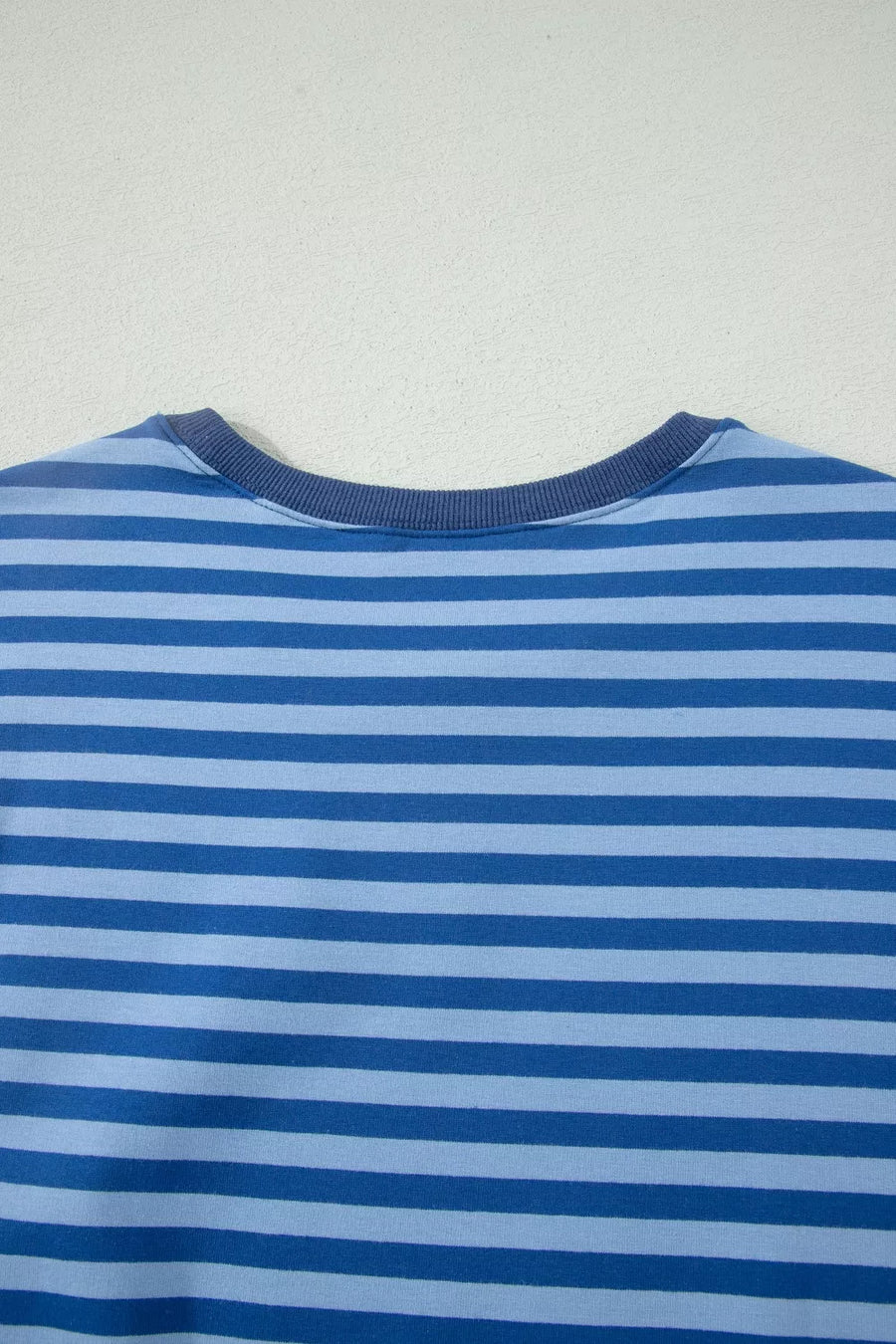 Blue striped cotton crew neck top with ribbed neckline.