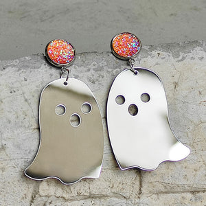 Ghostly iridescent acrylic dangle earrings with round glitter studs.