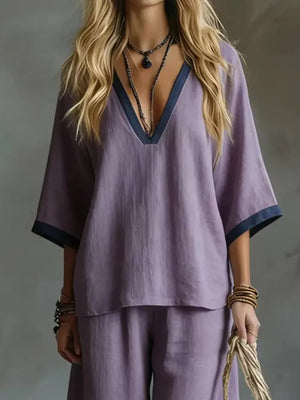 Purple V-neck two-piece set with contrast trim and wide sleeves.