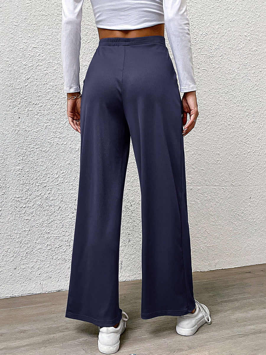 Navy wide leg trousers with a relaxed fit and elastic waistband.