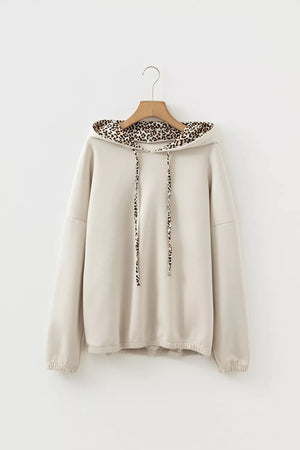 50% polyester, 45% viscose, 5% elastane Care instructions: Machine wash cold pullover hoodie in light beige with relaxed