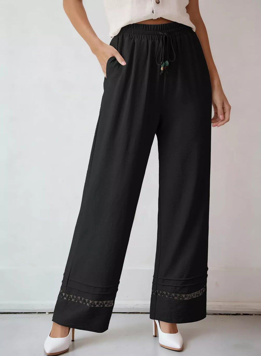 Black wide-leg maternity pants with drawstring and lace trim detail