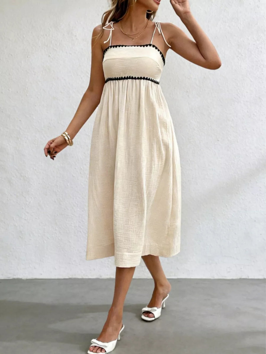 100% polyester Care instructions: Machine wash cold midi dress in Ivory with A-line silhouette