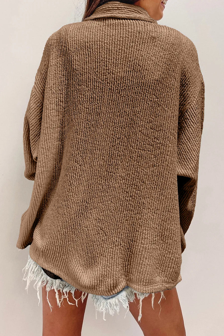 Camel textured corduroy overshirt with button front and patch pockets.