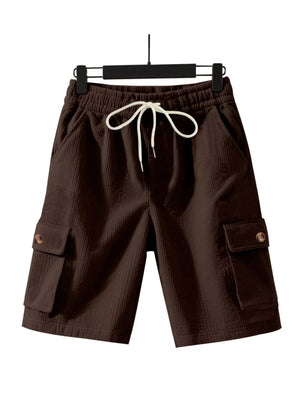 Brown textured drawstring cargo shorts with button flap pockets.