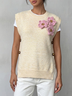 pink sweater vest with decorative button and sleeveless