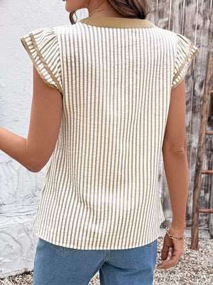 Vertical stripe blouse with tan trim and ruffle sleeves.