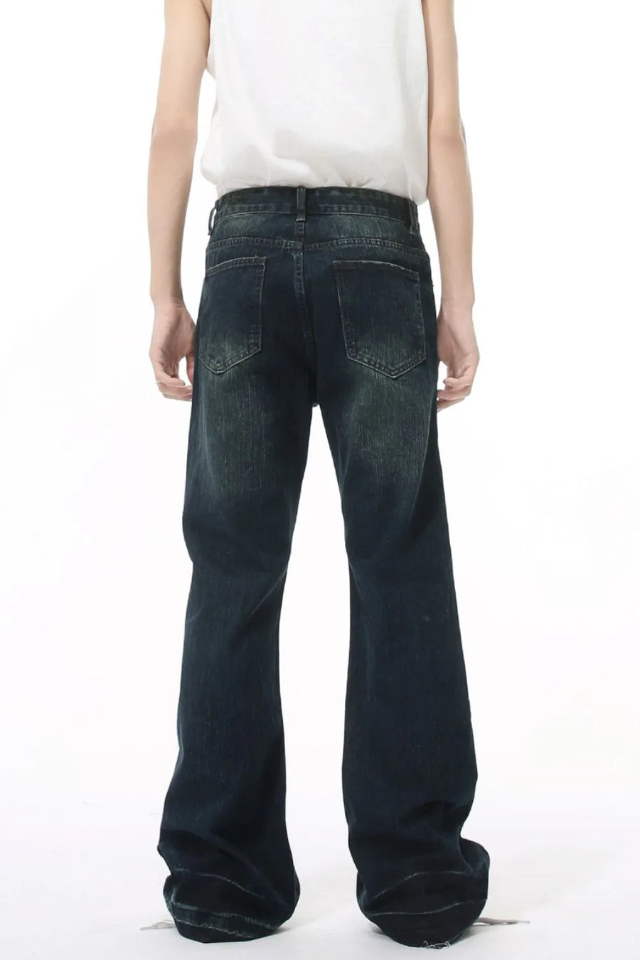 Dark wash flared jeans with vintage fading and a relaxed fit.