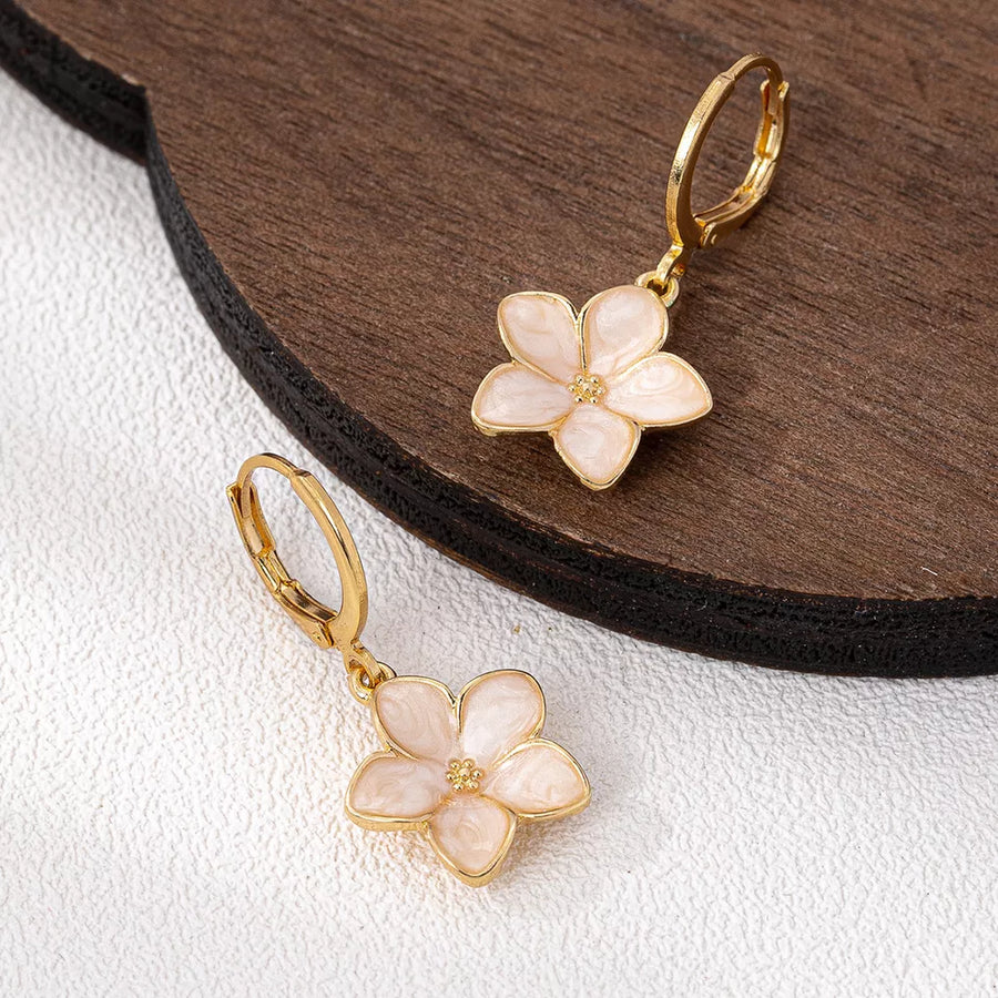 earrings in Gold with floral and flower charm