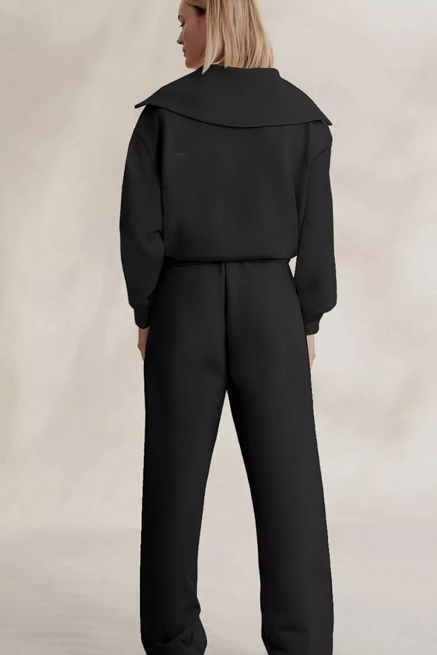 Black sweatshirt and sweatpants set with seam detail and long sleeve