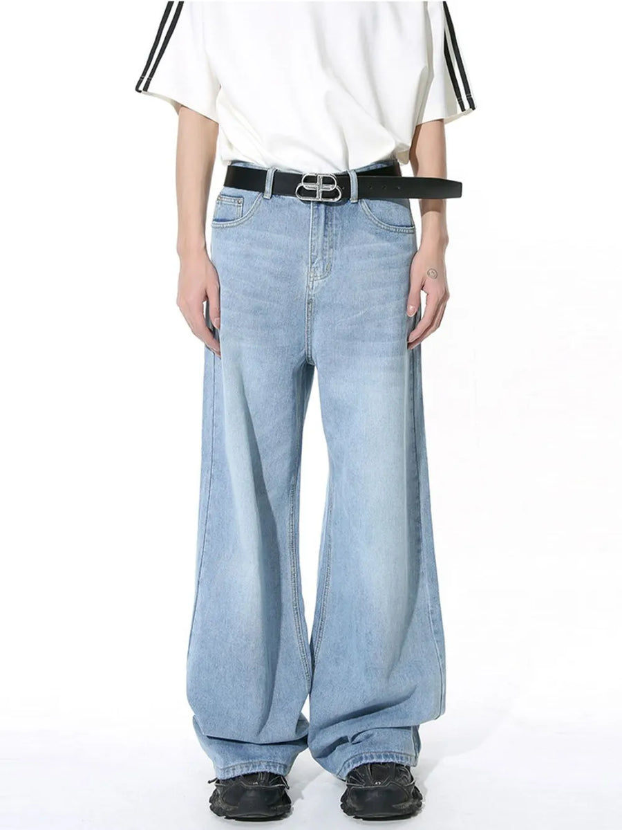 Light blue wide-leg denim jeans with vintage wash and a relaxed fit.