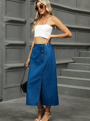 Button-front denim A-line midi skirt in medium blue with a front slit and button closure.