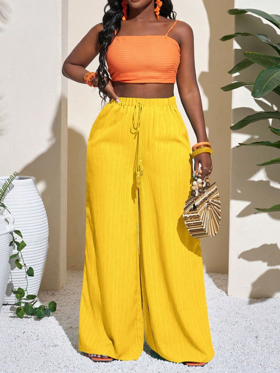wide-leg pants in yellow featuring drawstring waist and wide-leg fit