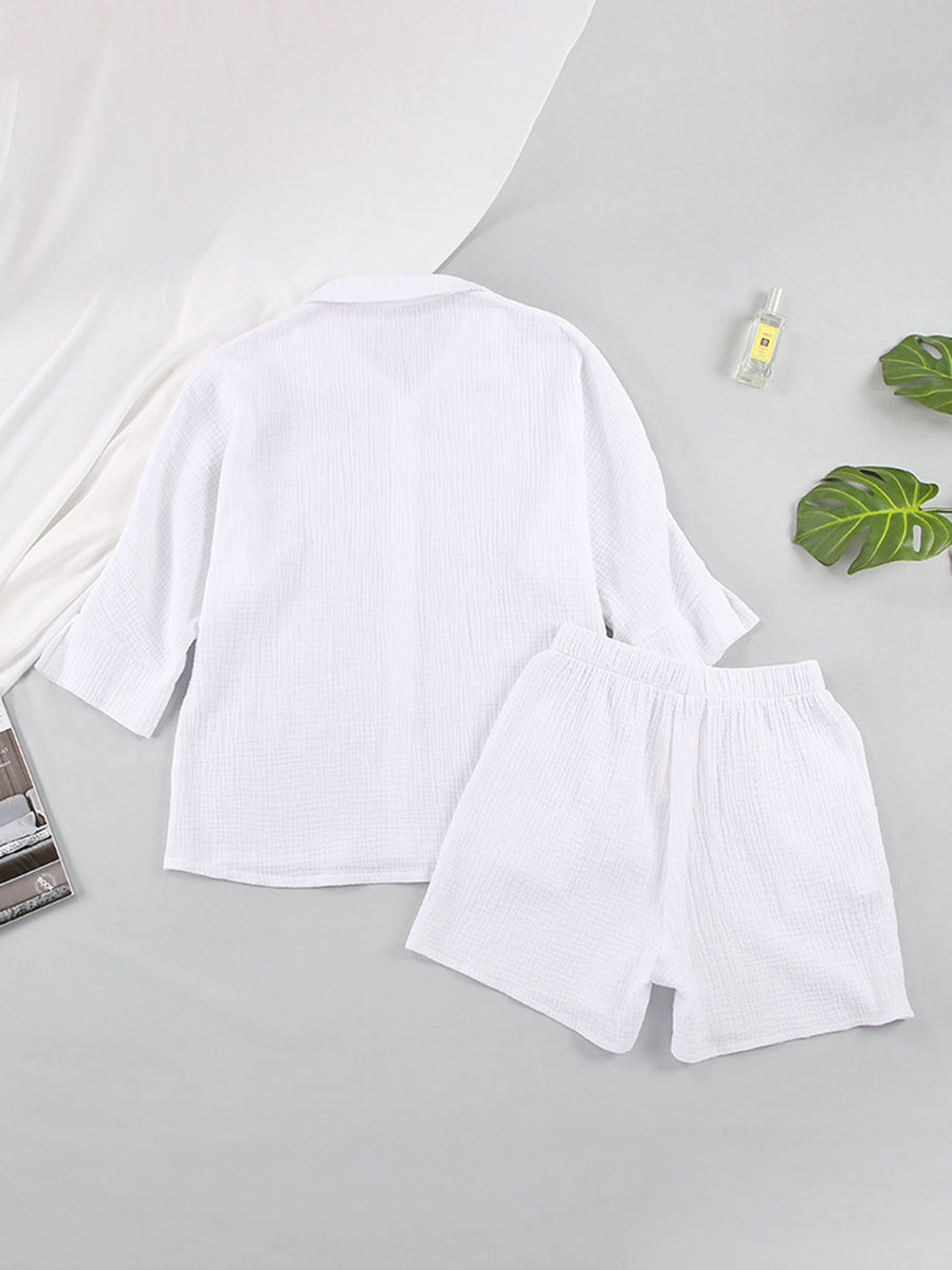 White gauze cotton resort shirt and shorts set with buttoned front and elastic waist.