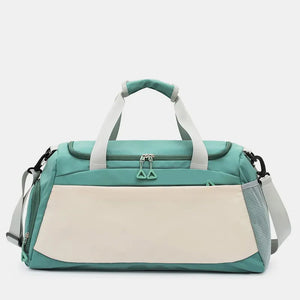 Colorblock duffel bag in turquoise and beige with dual zippers and shoulder strap.
