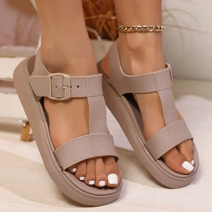 Mocha T-strap buckle platform sandals with adjustable strap and thick sole.
