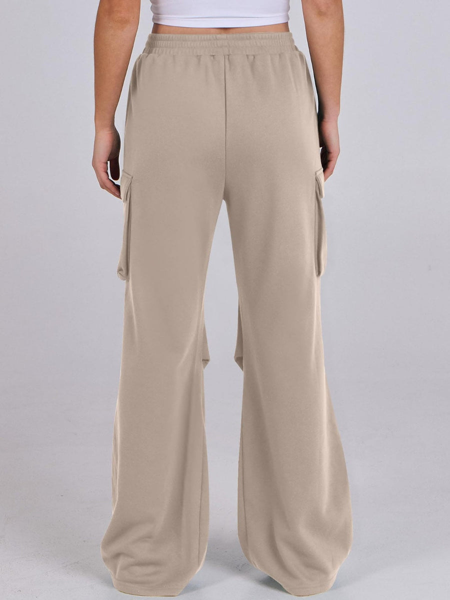 Tan sweatpants with cargo pockets and a wide leg silhouette.