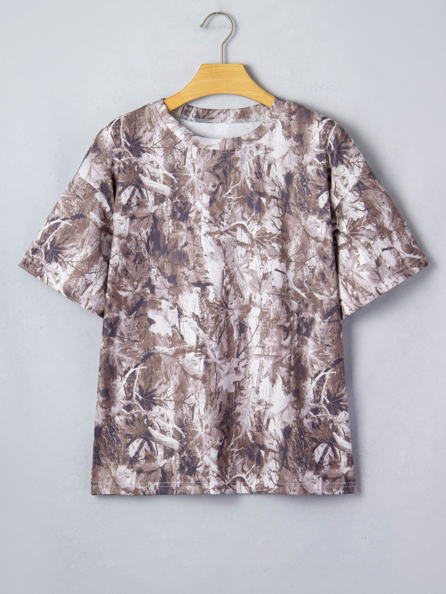 Woodland camouflage tunic with crew neck and short sleeves.