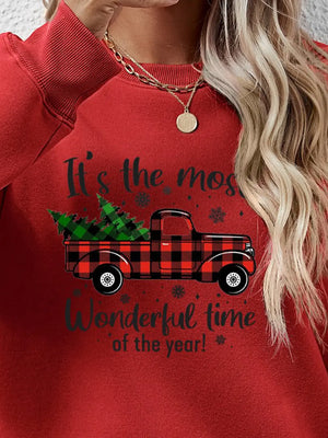 Red sweatshirt with buffalo plaid truck graphic and holiday text.
