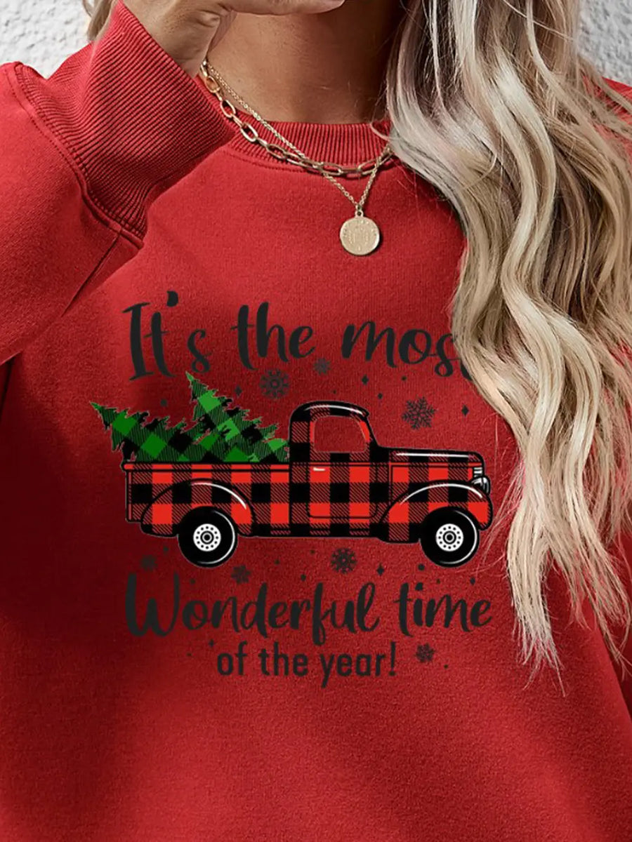 Red sweatshirt with buffalo plaid truck graphic and holiday text.