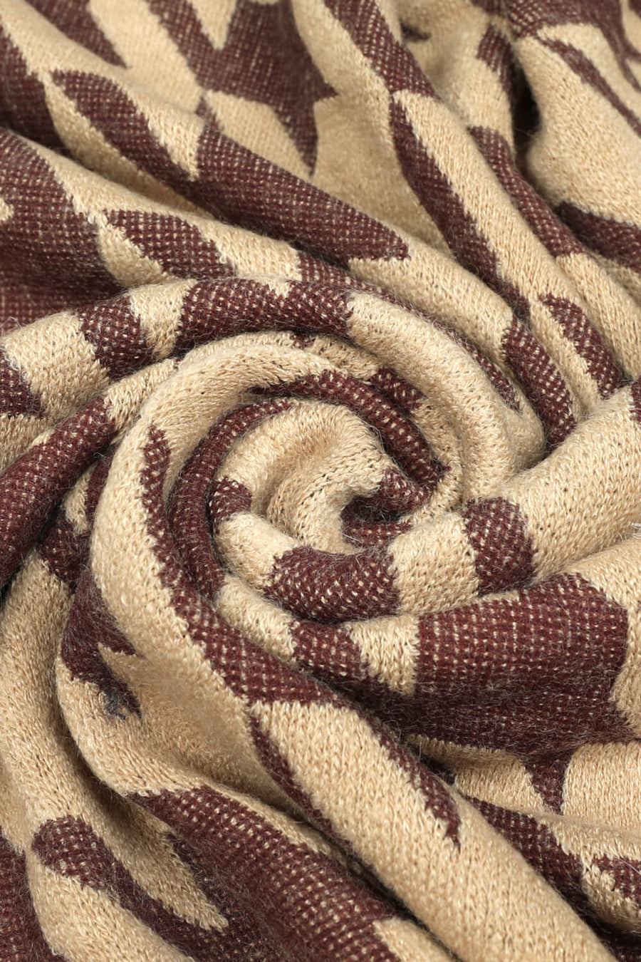 Houndstooth faux fur collar poncho in beige with brown pattern detail.