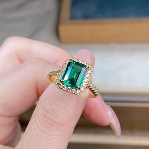 emerald green ring featuring geometric stone and geometric