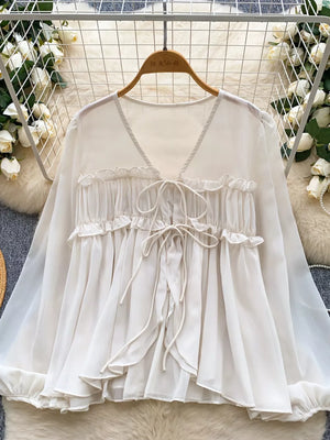 Chiffon tie-front blouse with ruffles and V-neck in Apricot.