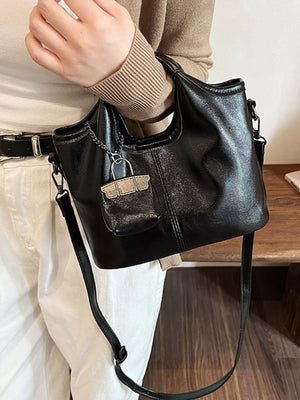 Black PU leather crossbody bag with chain and mini bag charm