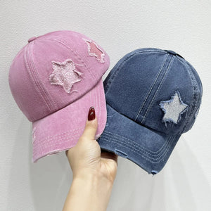 Stellar snapback cap baseball cap in dusty pink and dusty blue with distressed star patches.