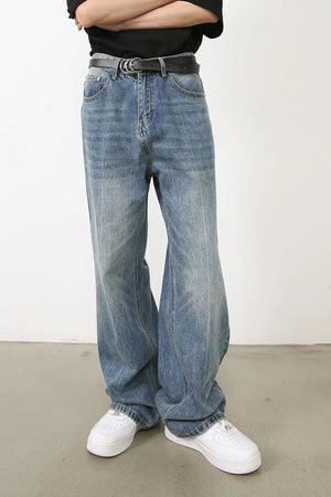 Wide-leg washed denim jeans in medium blue, relaxed fit, with a casual vibe.