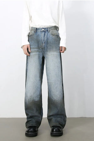 Faded gradient wide-leg jeans in medium wash denim with a relaxed fit.