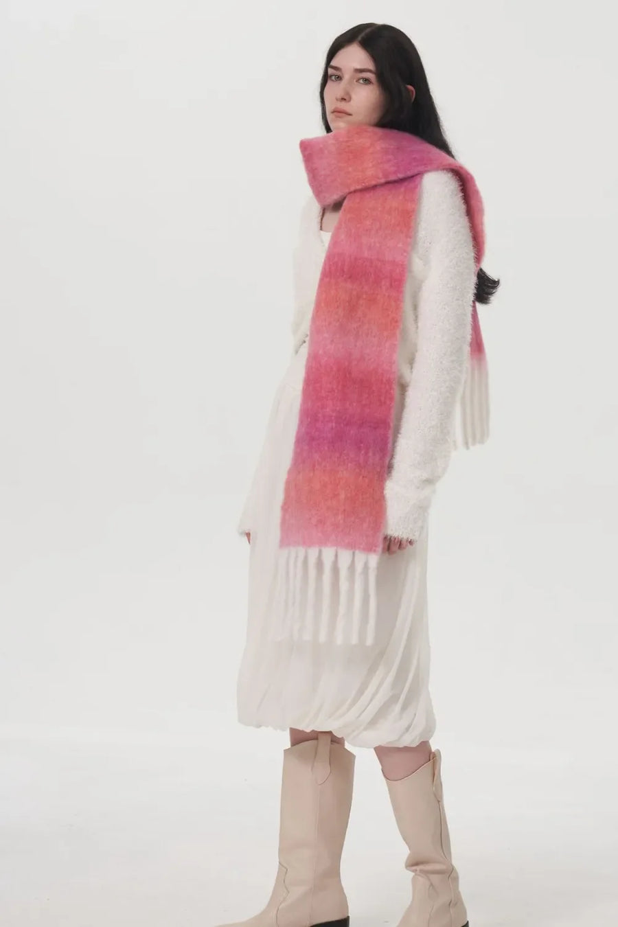 Gradient mohair fringe scarf in hot pink and orange hues with white fringe detail.