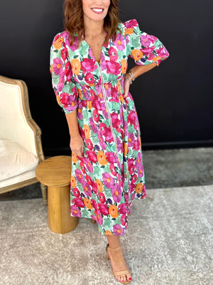 Floral V-neck zip midi dress with smocked waist and puff sleeves.