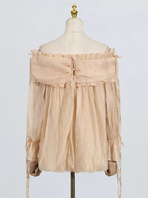 Champagne off-shoulder ruffled maternity blouse with button back and tie sleeves