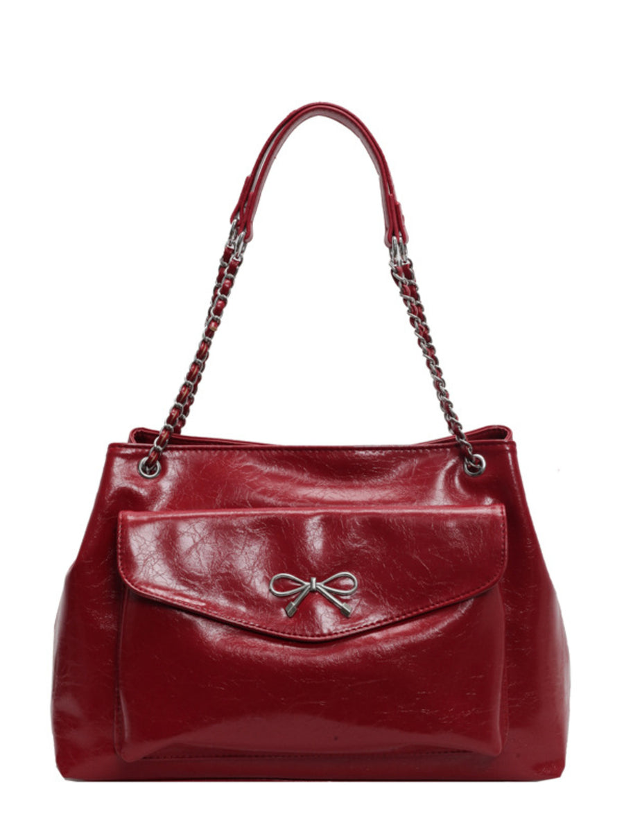 black with shoulder bag with bow detail