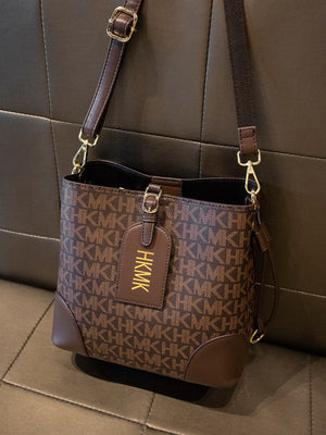 crossbody bag in dark brown with monogram and adjustable strap