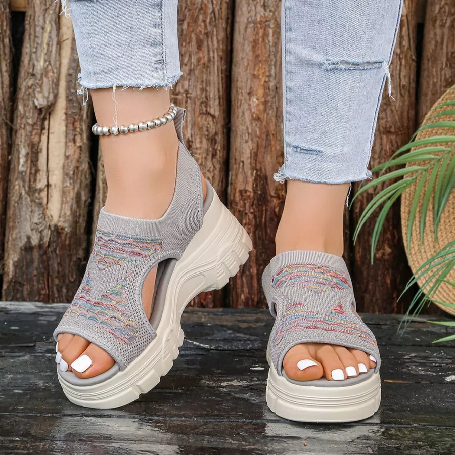 Gray geometric patterned open-toe platform sandals with colorful knit detail.